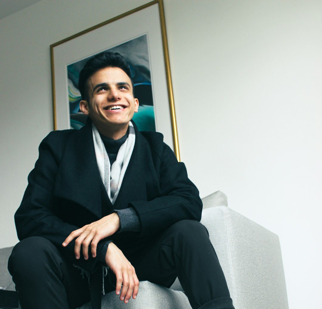 British broadcaster in a tailored suit posing for a portrait