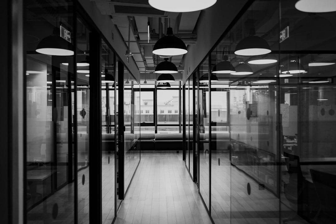 Bright hallway between glass office doors